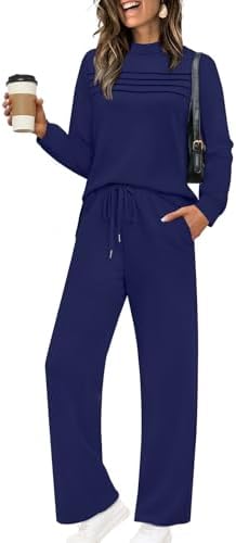 Dark blue spacer knit shapes this two-piece set, pairing a pleated long sleeve top with cropped wide leg pants.