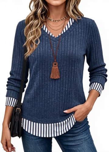 Striped navy paneling gives this layered-look long sleeve top crisp office polish without the bulk of two separate shirts.