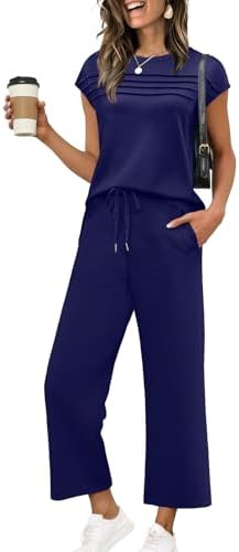 A deep dark blue matching set in lightweight spacer fabric, pairing a pleated cap sleeve top with cropped wide leg pants.