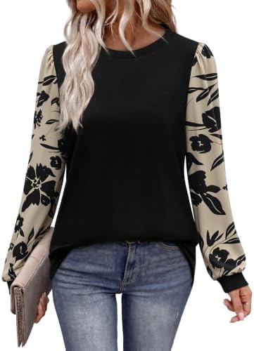 Soft puff sleeves printed in floral black and tan give this lightweight tunic top an easy contrast against the solid black bodice.
