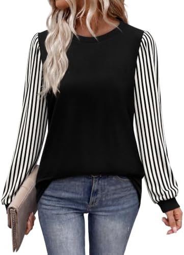 Striped puff sleeves set against a black and beige color block body give this tunic length crewneck a crisp, layered look.