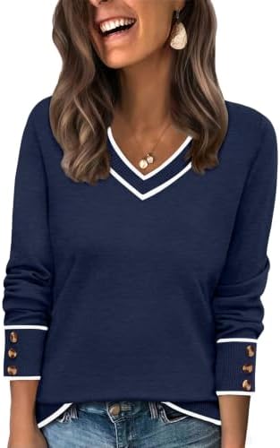 Deep color blocking grounds this navy blue cable knit, shaped with a wide V-neck collar and buttoned cuffs for cool evenings.