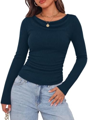 A softly draped cowl neck in deep navy blue knit, finished with ruched sides and full-length sleeves for easy layering.
