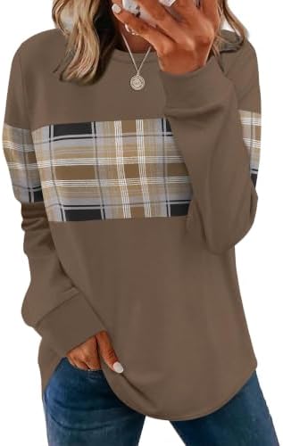A curved tunic hem and unique brown plaid color blocking bring warm tones to this lightweight, loose-fitting crewneck top.