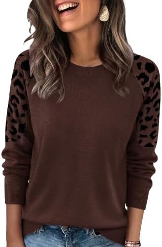 A deep chocolate brown knit pullover detailed with jacquard leopard raglan sleeves for a soft layer when the air cools down.