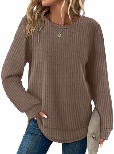 A softly textured waffle knit with a classic crewneck and an extended curved hem cut to pair with your favorite leggings.