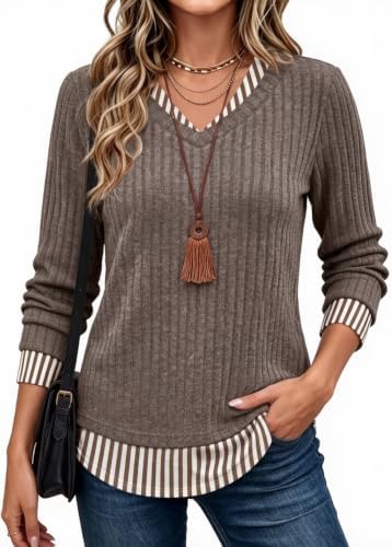 Warm striped brown patterning and a built-in contrast panel give this soft knit tunic the neat appearance of two layered pieces.