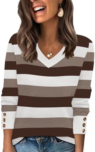 A wide V-neck tunic knit in Color Block Brown 02, finished with three decorative buttons along each cuff for easy fall layering.