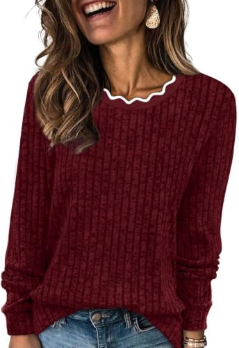 Scalloped curves along the neckline soften this holiday red knit, giving a plush texture plenty of room through the body.