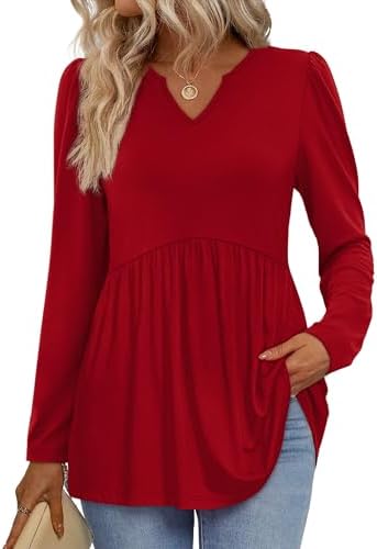 A vivid holiday red top cut in a lightweight knit with subtle puff sleeves and a flowing empire waistline.