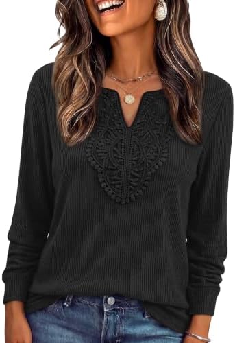 Delicate lace borders the neckline on this deep black ribbed tunic, giving you a steady base layer for workdays and cool nights.