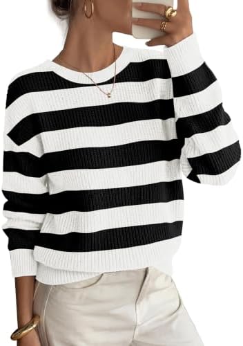 Crisp black and white stripes run across this chunky ribbed knit pullover, cut with dropped shoulders for easy layering.