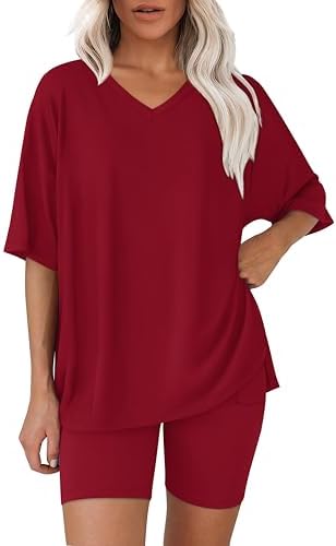 Cut in deep winered, this two-piece set pairs an oversized V-neck shirt with smooth pull-on biker shorts.