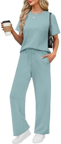 Cool lake blue tones define this airy two-piece set, cut with a color-block crew neck tee and drapey wide-leg pants.