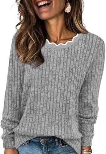 Scalloped curves along the neckline soften this heather grey knit tunic, cut loose for easy layering on cool days.