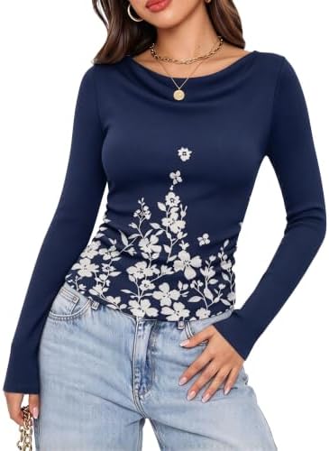 A draped cowl collar and side ruching bring texture to this long sleeve knit in deep navy floral.