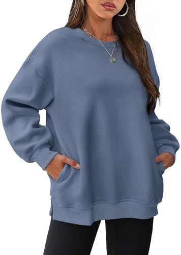 Side slits and concealed pockets give this grey blue fleece crewneck an easy drape for crisp morning walks or cool summer nights.