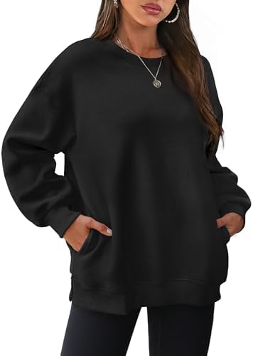 A soft fleece backing and side slits give this deep black long sleeve top an easy drape over denim or leggings on chilly days.