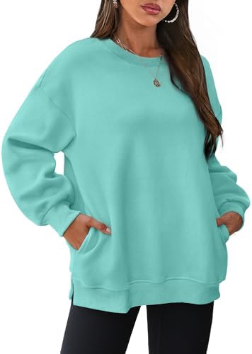 A soft mint green fleece pullover cut with side slits and hidden pockets for crisp morning walks or cool summer nights.