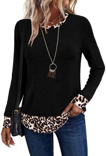 A solid black crewneck pullover cut with a bold leopard print contrast hem in a lightweight, blanket-soft knit.