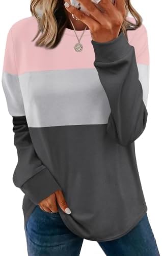 Contrast panels in unique pink give this lightweight crewneck tunic a lively tone, finished with side slits and a curved hem.