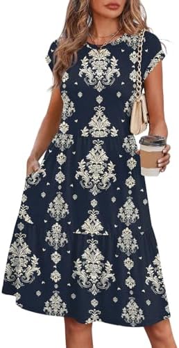 Swirling navy damask prints cover this tiered babydoll dress, cut with cap sleeves and built-in side pockets.