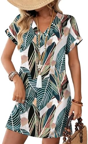 Lush green palm fronds over a soft knit base give this relaxed v-neck dress an easy vacation look from beach walks to brunch.