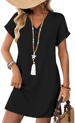 A relaxed solid black tshirt dress cut with a subtle v-neck, rolled short sleeves, and deep side pockets for summer days.