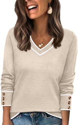 Soft beige color blocking meets a wide V-neck in this lightweight knit sweater finished with neat buttoned cuffs.