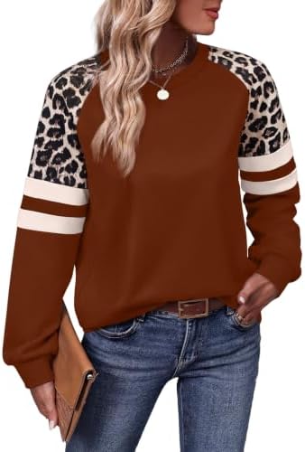 A rich caramel solid body meets patterned leopard sleeves on this relaxed crewneck tunic cut for easy everyday wear.