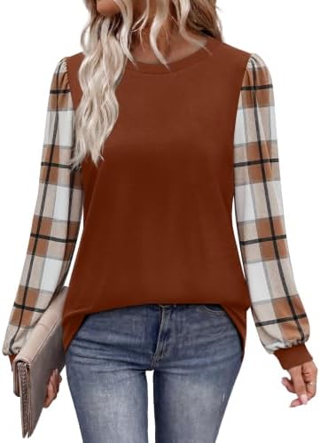 Plaid sleeves in warm caramel meet a solid bodice on this long sleeve tunic cut for easy layering over jeans or leggings.