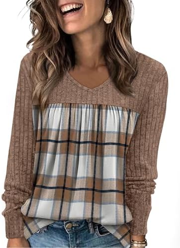 A soft ribbed knit tunic in brown black plaid with front pleats and a classic V-neckline for easy layering on cool days.
