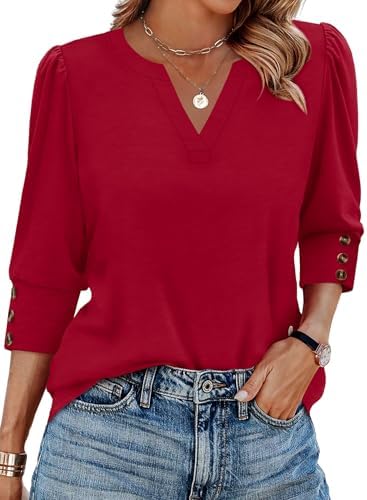 A rich red knit cut with triple-button three-quarter sleeves and a curved hem that sits cleanly over trousers or denim.