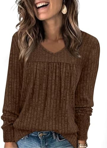 A soft ribbed knit tunic in deep mocha brown, cut with a relaxed V-neck and gentle front pleats for cool days.