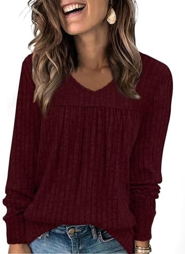 Deep maroon ribbed knit shapes this long sleeve top, featuring a soft V-neck and neat front pleating for an easy drape.
