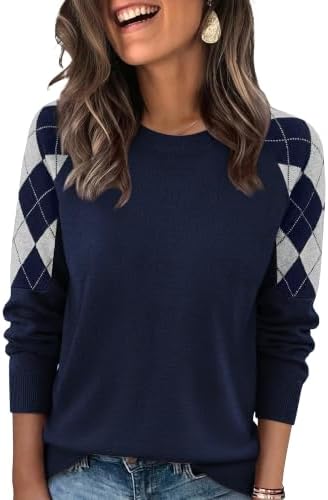 Crisp navy blue knitting meets geometric diamond jacquard sleeves in a lightweight layer designed for brisk autumn days.