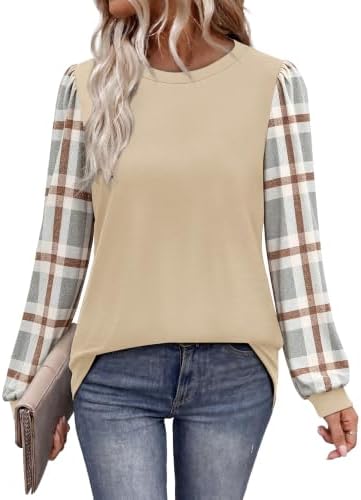 Contrasting plaid sleeves give this neutral beige tunic a relaxed layered look that pairs neatly with dark trousers.