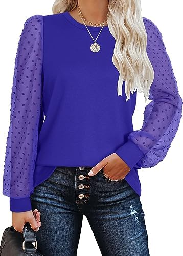 Sheer textured sleeves meet a soft knit body in a saturated bright blue that pairs cleanly with light denim or dark trousers.