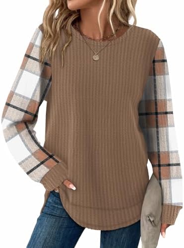 A soft waffle knit tunic in warm brown checkered print, finished with a classic round neck and a gentle curved hemline.