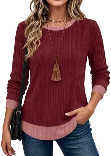 Layered colorblock trims at the neck and hem give this vibrant red long sleeve top the look of two pieces in one soft knit.