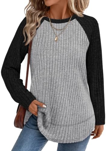 A balanced mix of neutral tones shapes this ribbed long sleeve top, cut with side slits and a high-low hem for easy layering.