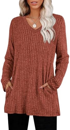 A rich caramel hue warms up this lightweight ribbed knit tunic, cut with a relaxed sweep and practical side pockets.