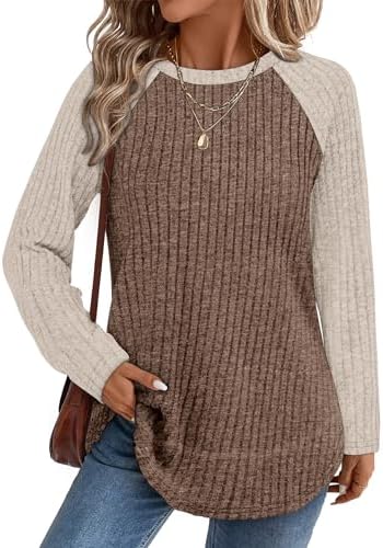 A soft ribbed knit tunic with a curved high-low hem and side slits for easy layering when the weather cools.