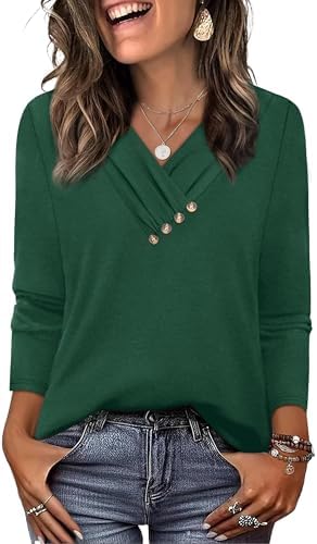 A rich green tunic cut with a neat V-neck and decorative front buttons, designed to fall past the hips over leggings.