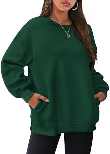 A deep forest tone anchors this soft fleece-lined crewneck, cut roomy through the body with side slits and hidden pockets.