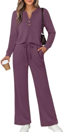 A deep dark purple two-piece set cut from silky spacer knit with a notched neckline and roomy wide-leg pants.
