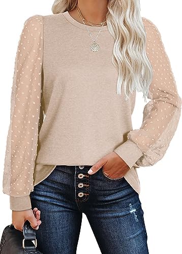 Sheer puff sleeves covered in woven swiss dots give this beige knit tunic a clean balance of ease and texture.