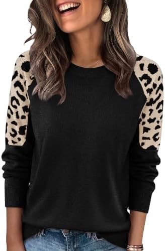A solid black knit body pairs with jacquard leopard sleeves on this lightweight raglan pullover for crisp days.