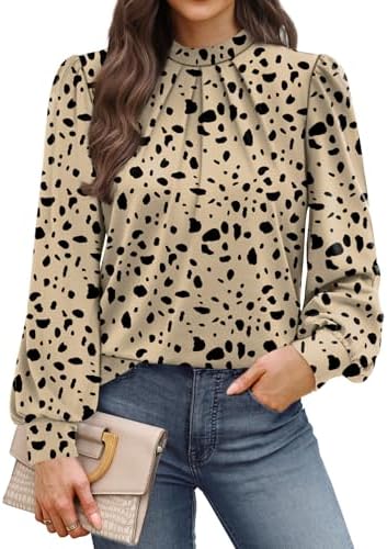 Subtle black dots across a warm taupe ground give this stretchy mock neck top a neat, tailored look for work days.
