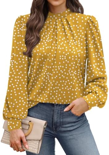 Crisp yellow polka dots bring a cheerful pop of pattern to this mock neck blouse cut with gentle front pleats and puffed sleeves.